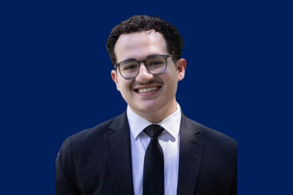 Political Science student being presented with award by professor.