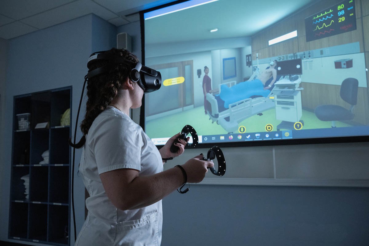 Female student wearing virtual reality headset