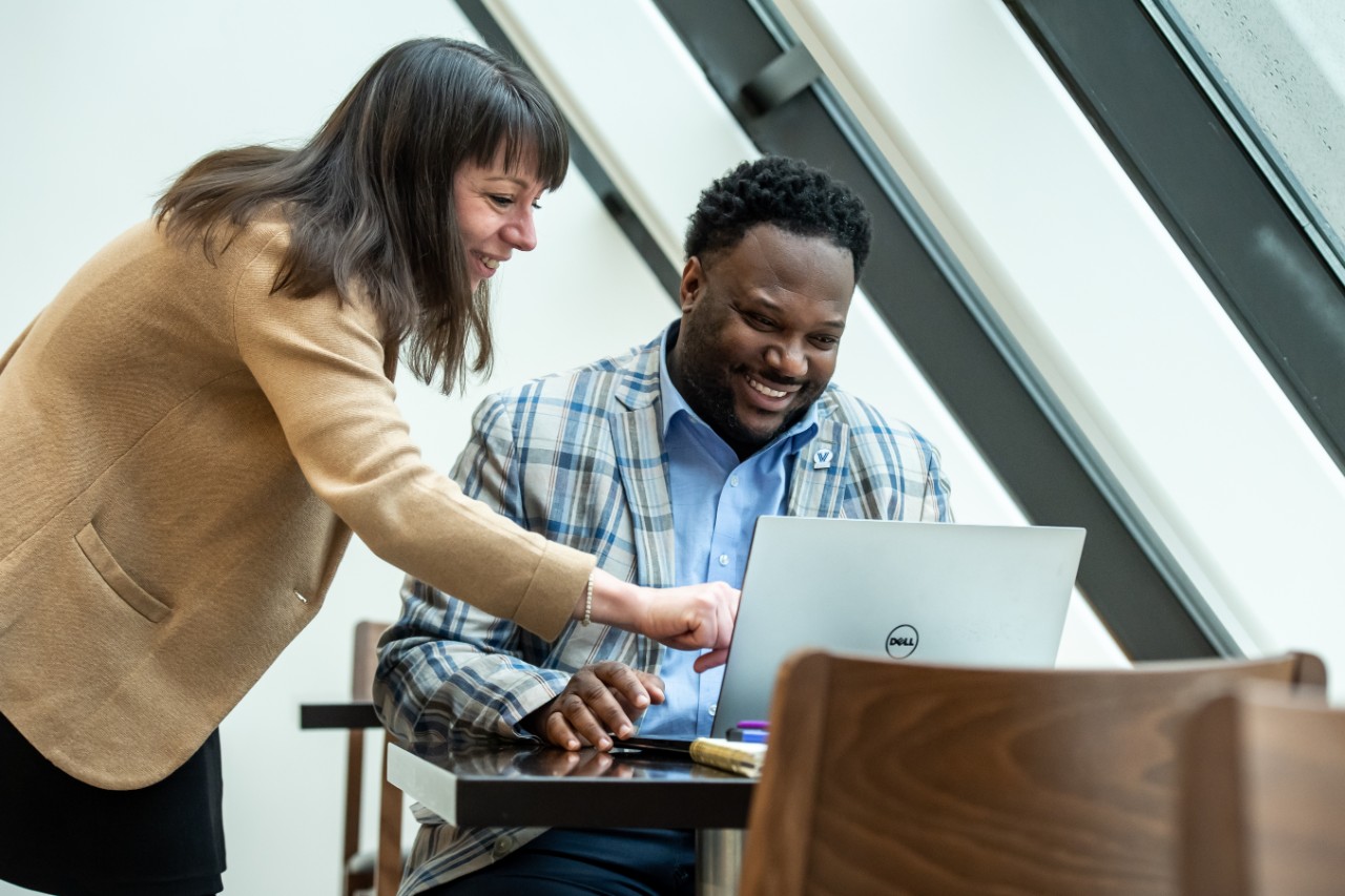 An EMBA student with a professor