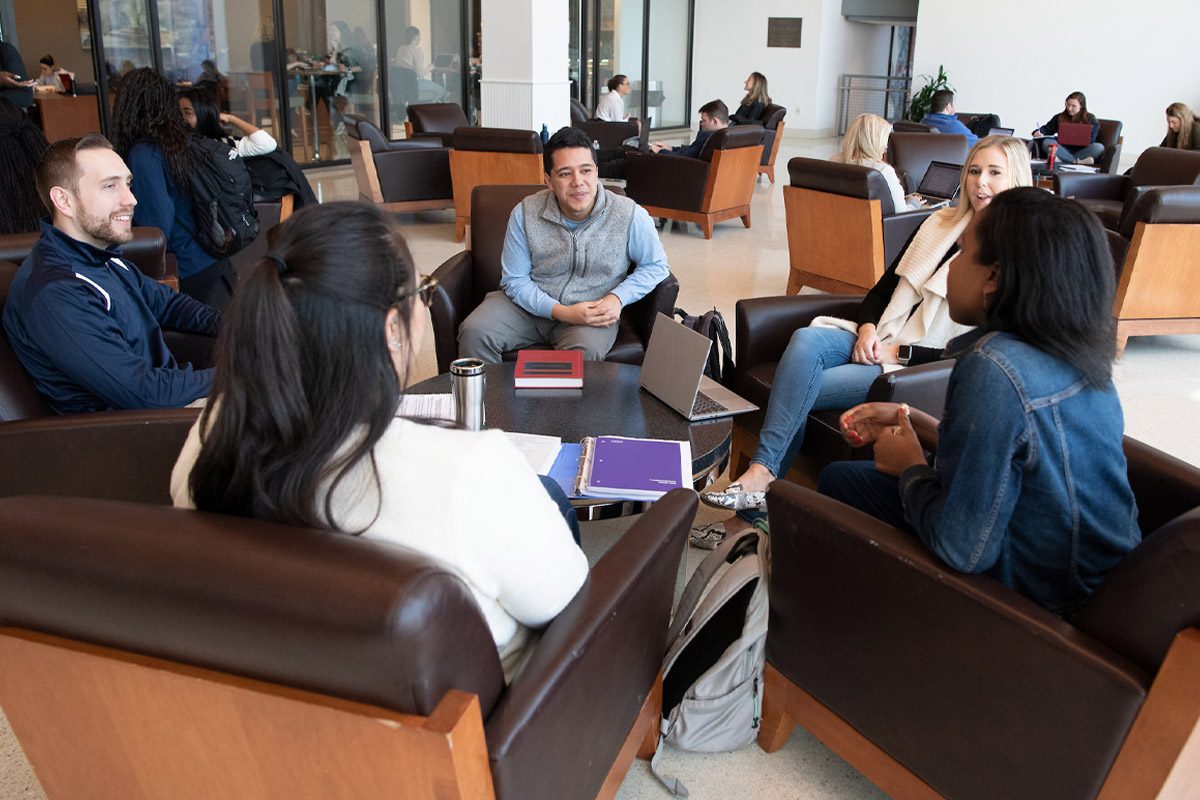 5 students having a discussion