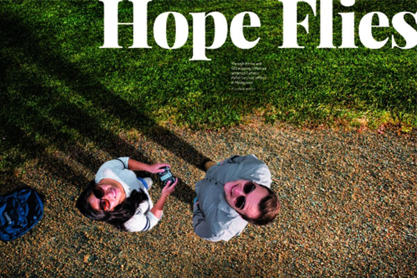 Arial shot of two students flying a drone