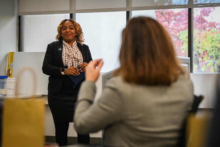 Two women speaking in a classroom setting