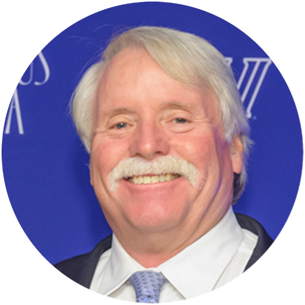 Headshot of Joseph V. Topper smiling directly at the camera. 